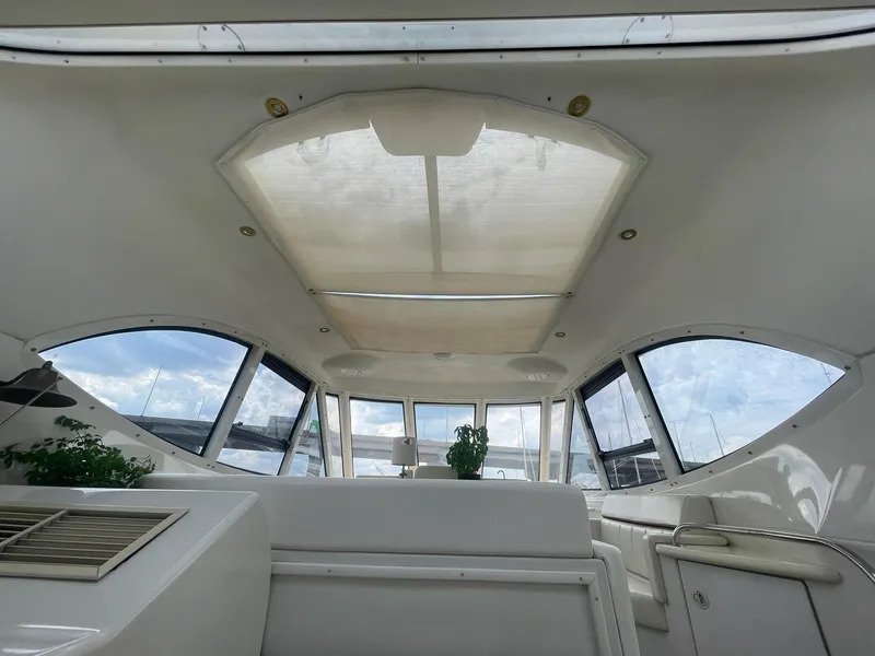 Slide: The Image of Interior view of 2000 Carver 506 Motor Yacht with large windows and skylight. - 44