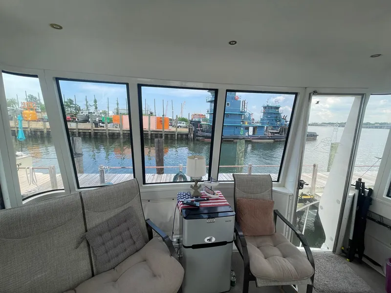 Slide: The Image of Interior view of 2000 Carver 506 Motor Yacht with waterfront backdrop. - 46