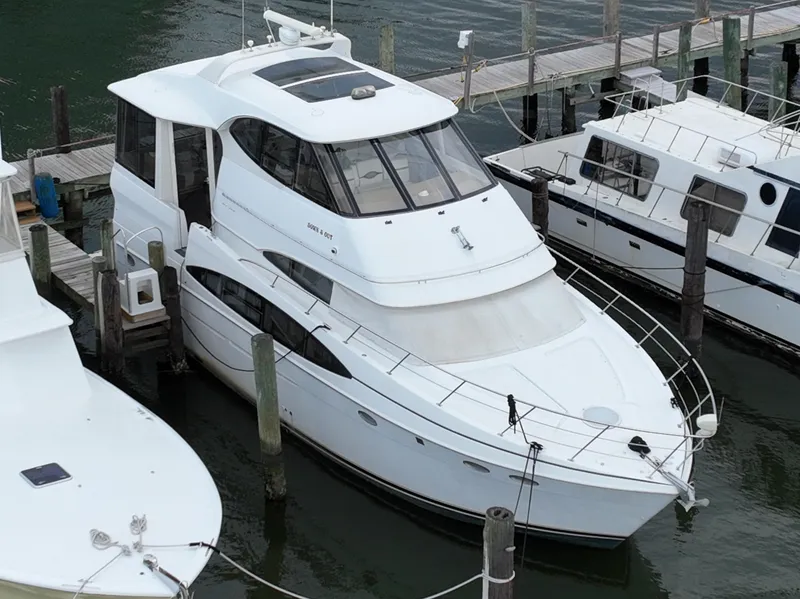 Slide: The Image of 2000 Carver 506 Motor Yacht docked at marina, aerial view. - 2