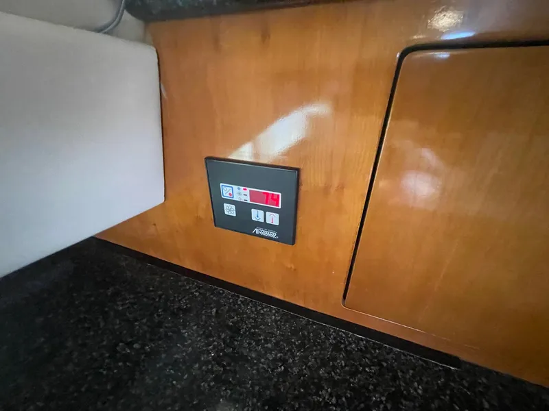 Slide: The Image of Control panel on 2000 Carver 506 Motor Yacht's wooden interior. - 25