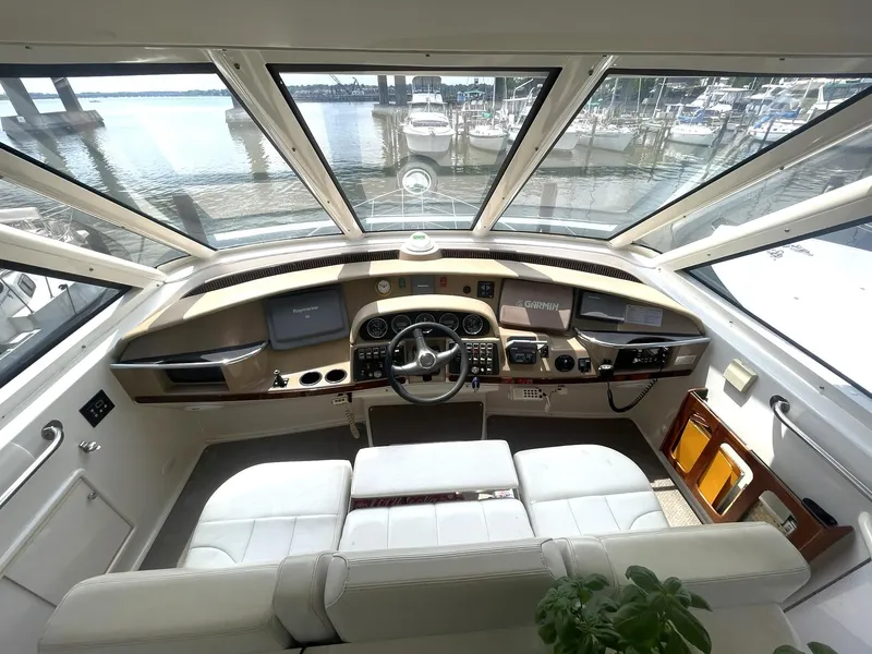 Slide: The Image of Helm of 2000 Carver 506 Motor Yacht with panoramic windows and modern controls. - 31