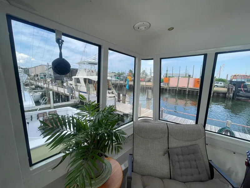 Slide: The Image of Interior view of 2000 Carver 506 Motor Yacht with marina backdrop. - 45