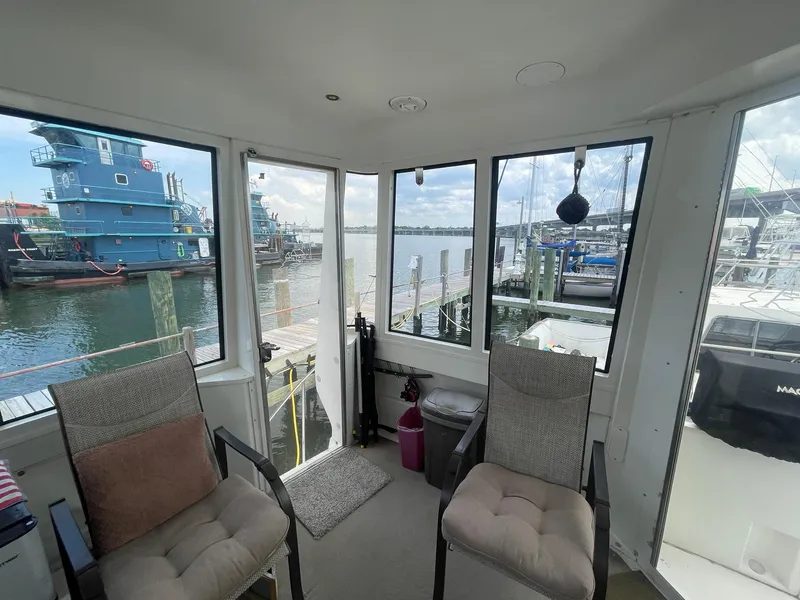 Slide: The Image of Interior view of 2000 Carver 506 Motor Yacht with marina backdrop. - 47