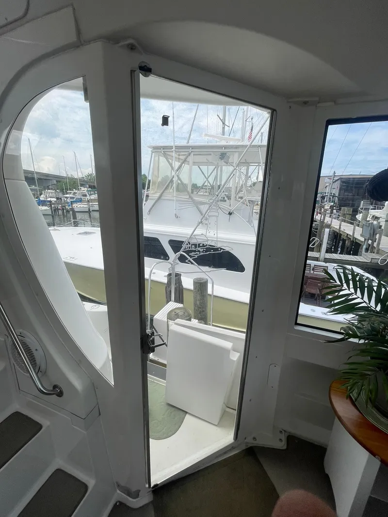 Slide: The Image of Interior view of 2000 Carver 506 Motor Yacht with marina background. - 48