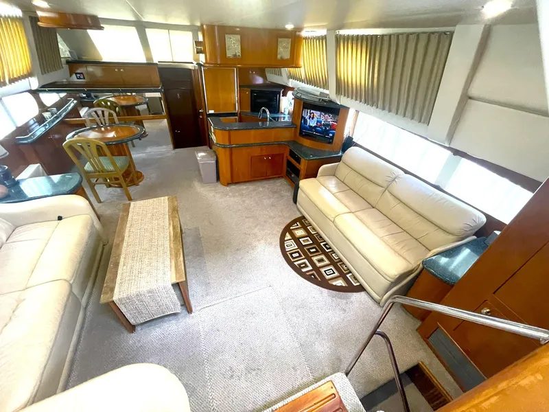 Slide: The Image of Interior of 2000 Carver 506 Motor Yacht with spacious seating and modern amenities. - 7