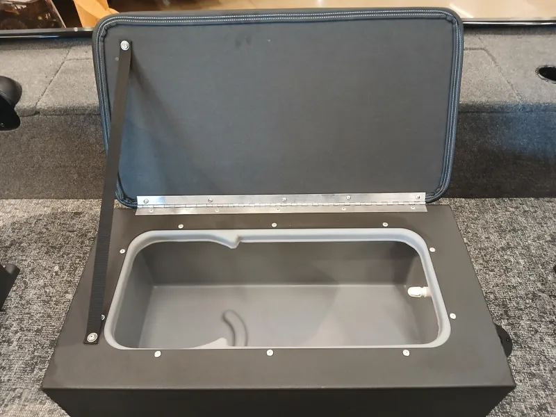 Slide: The Image of Open storage compartment in 2025 Tracker Panfish 17 boat, featuring a spacious interior. - 10