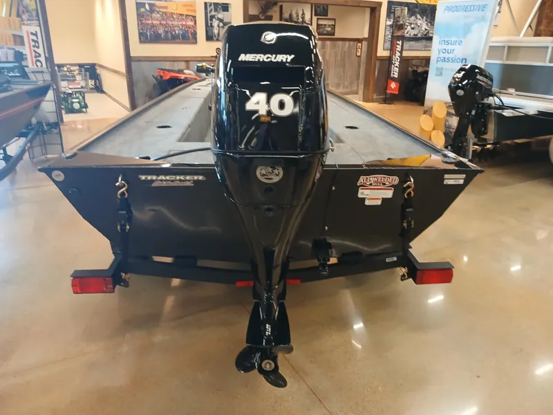 Slide: The Image of 2025 Tracker Panfish 17 boat with Mercury 40 outboard motor displayed indoors. - 16