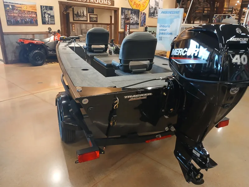 Slide: The Image of 2025 Tracker Panfish 17 boat with Mercury 40 engine displayed indoors. - 18