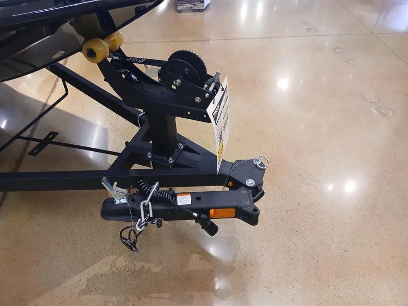 Slide: The Image of 2025 Tracker Panfish 17 trailer hitch on polished concrete floor. - 19