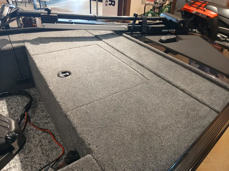 Slide: The Image of 2025 Tracker Panfish 17 boat deck with carpeted surface and mounted equipment. - 3