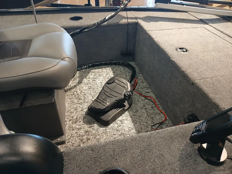 Slide: The Image of Interior of 2025 Tracker Panfish 17 boat with seating and foot pedal. - 6
