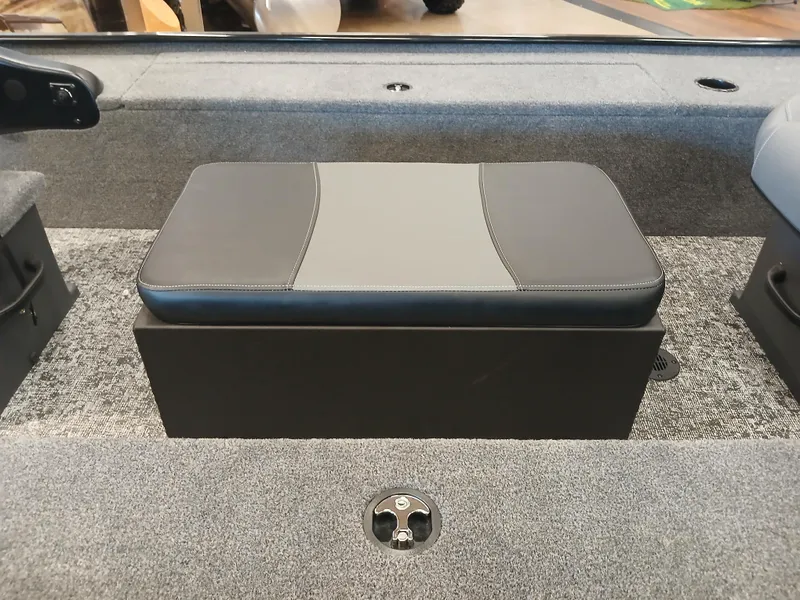 Slide: The Image of 2025 Tracker Panfish 17 boat seat with gray upholstery and storage compartment. - 9