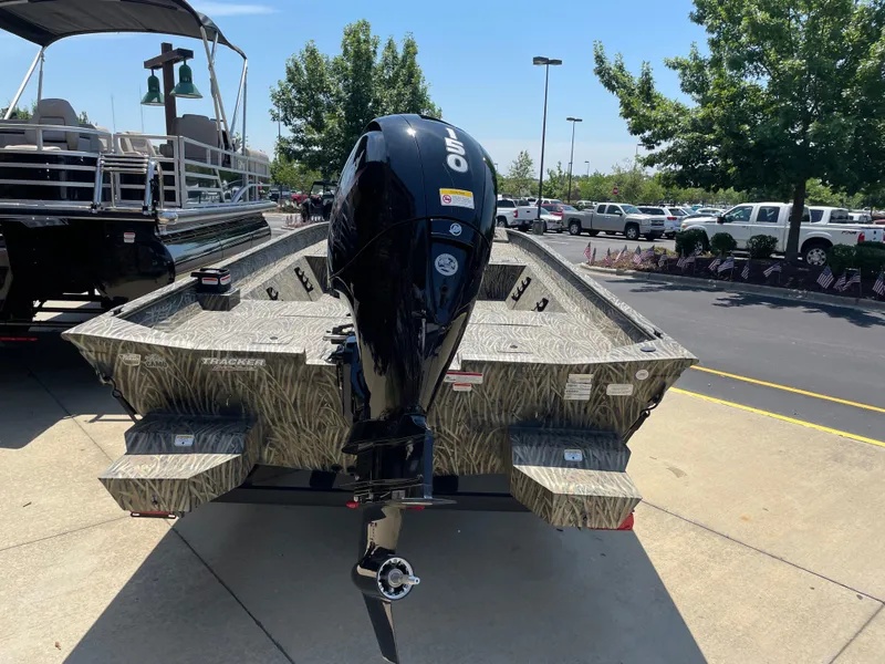 Slide: The Image of 2025 Tracker Grizzly 2072 CC boat with camouflage design and powerful outboard motor. - 3