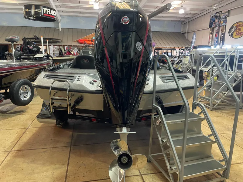 Slide: The Image of 2025 Ranger Z518 boat with powerful outboard motor displayed indoors. - 4