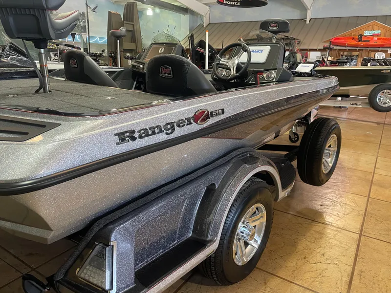 Slide: The Image of 2025 Ranger Z518 boat displayed indoors, showcasing sleek design and modern features. - 5