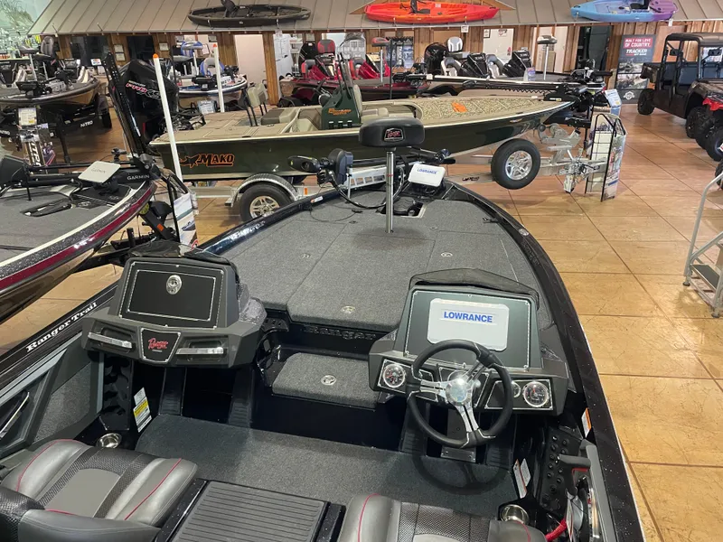 Slide: The Image of 2025 Ranger Z518 boat interior with advanced navigation system in showroom display. - 8