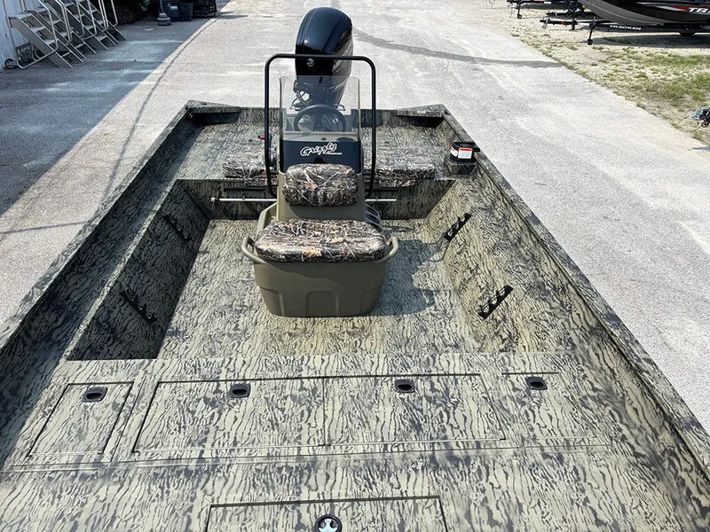 Slide: The Image of 2025 Tracker Grizzly 2072 CC boat with camouflage seating and spacious deck. - 11