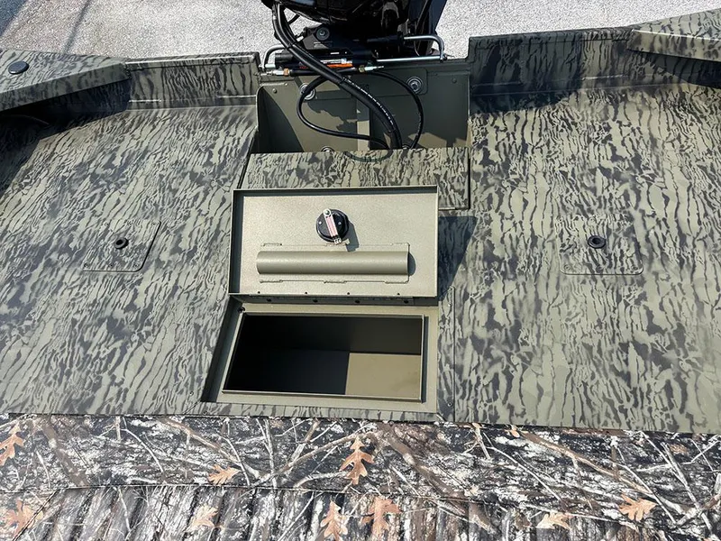 Slide: The Image of 2025 Tracker Grizzly 2072 CC boat with open storage compartment, camo pattern design. - 18