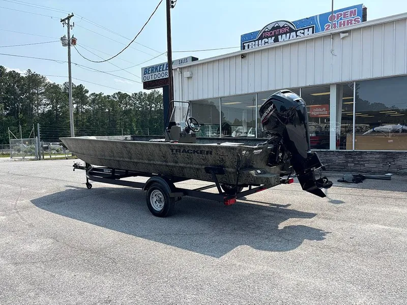 Slide: The Image of 2025 Tracker Grizzly 2072 CC boat on trailer outside a truck wash facility. - 3