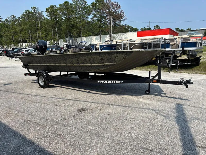Slide: The Image of 2025 Tracker Grizzly 2072 CC boat on trailer in outdoor lot. - 5