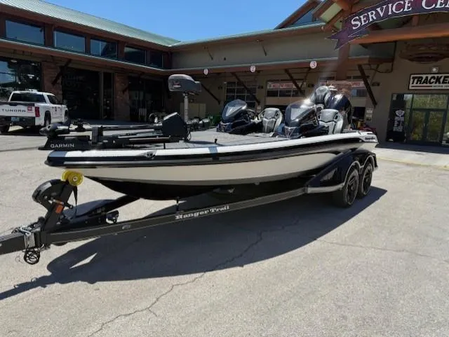 Slide: The Image of 2025 Ranger Z520R boat on trailer outside service center. - 0