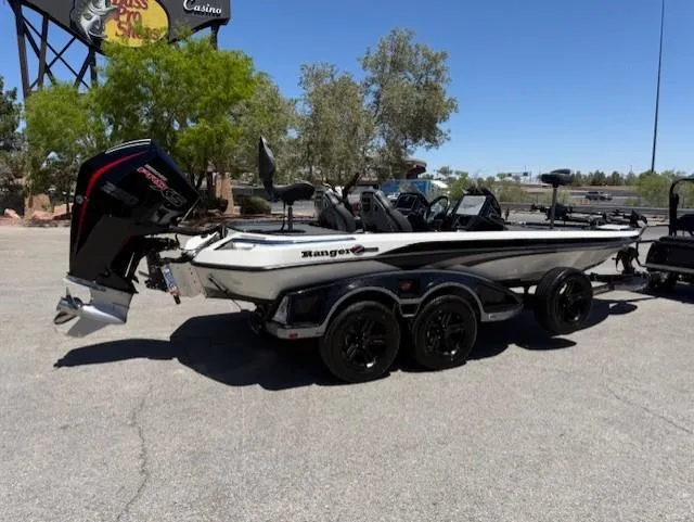 Slide: The Image of 2025 Ranger Z520R boat with trailer, parked outdoors on a sunny day. - 1