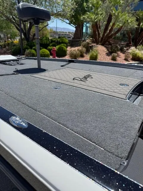 Slide: The Image of 2025 Ranger Z520R boat deck with lush greenery in the background. - 11