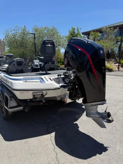 Slide: The Image of 2025 Ranger Z520R boat with powerful outboard motor, parked outdoors. - 8