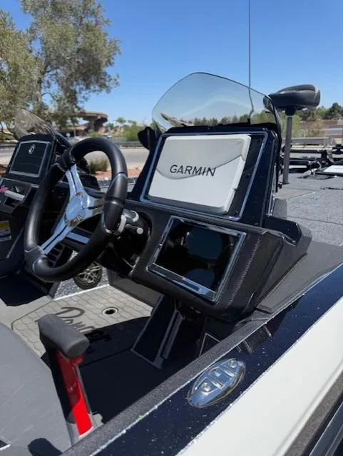 Slide: The Image of 2025 Ranger Z520R boat dashboard with Garmin navigation system, steering wheel, and control panel. - 9