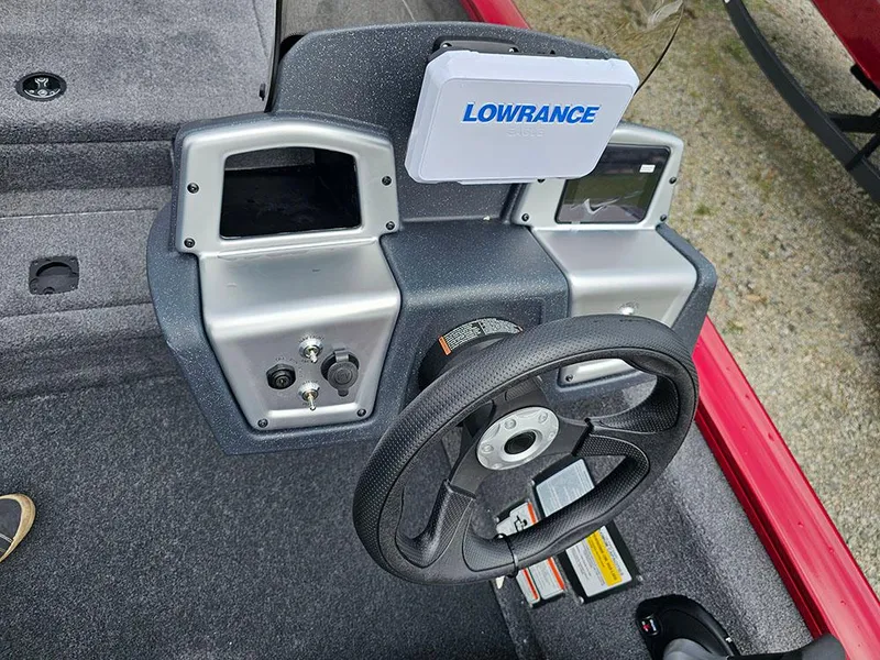 Slide: The Image of 2025 Tracker Pro Team 175 boat dashboard with Lowrance electronics and steering wheel. - 12