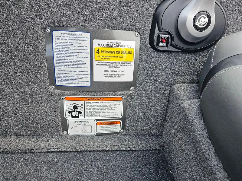 Slide: The Image of 2025 Tracker Pro Team 175 boat capacity and safety labels, showing maximum weight and passenger limits. - 13