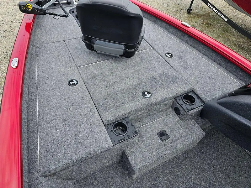 Slide: The Image of 2025 Tracker Pro Team 175 boat interior with gray carpet and seating. - 14