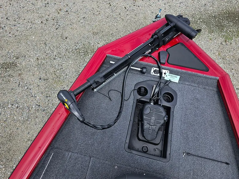 Slide: The Image of 2025 Tracker Pro Team 175 boat with trolling motor on red deck. - 19