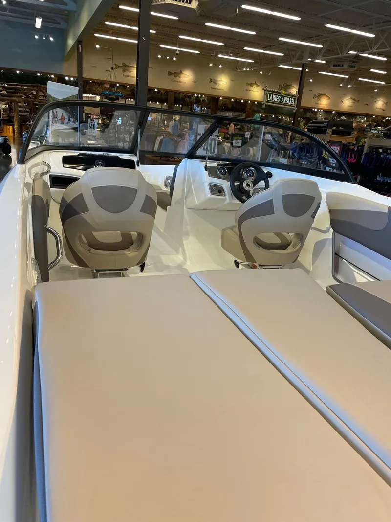 Slide: The Image of 2025 Tahoe 200 S boat interior with beige seating and modern dashboard. - 5