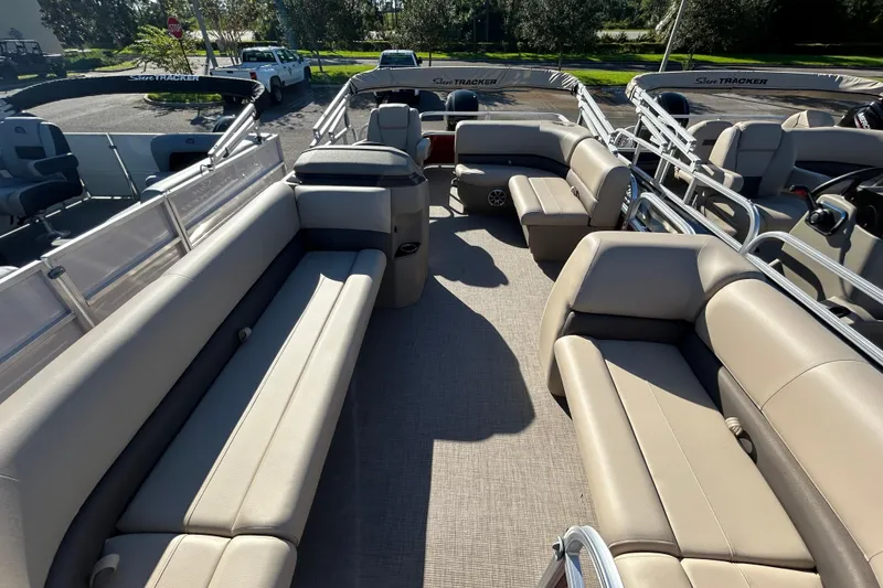 Slide: The Image of 2025 Sun Tracker Party Barge 18 DLX pontoon boat with spacious seating and modern design. - 2
