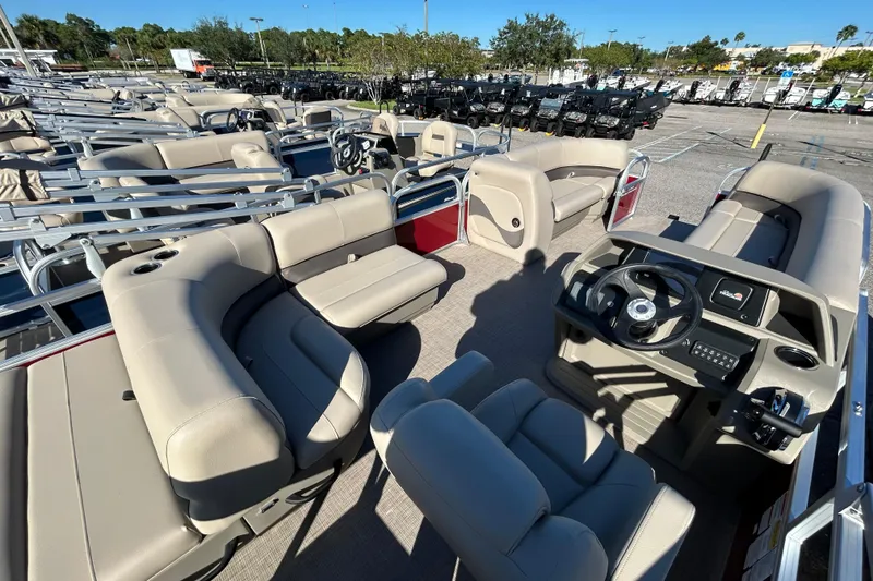 Slide: The Image of 2025 Sun Tracker Party Barge 18 DLX pontoon boat with spacious seating and modern helm. - 5