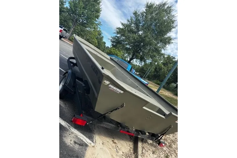 Slide: The Image of 2025 Tracker Grizzly 2072 Utility boat on trailer in parking lot. - 3