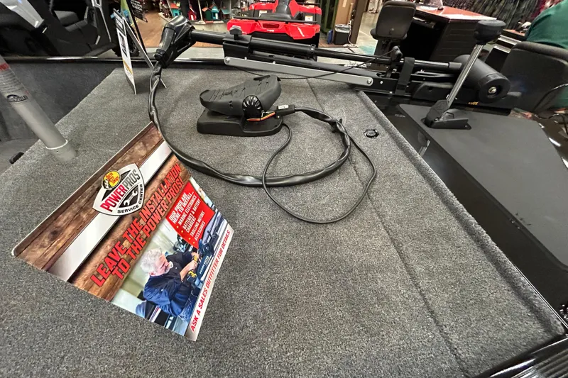 Slide: The Image of 2025 Tracker Bass Tracker Classic XL boat deck with trolling motor and installation sign. - 3