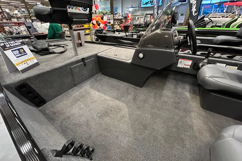 Slide: The Image of 2025 Tracker Bass Tracker Classic XL boat interior with seating and steering console. - 4