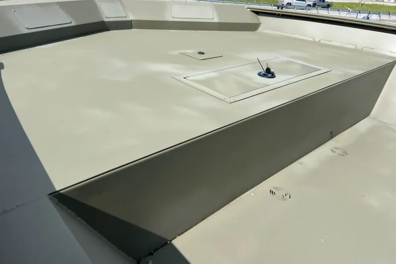 Slide: The Image of 2025 Tracker Grizzly 2072 Utility boat deck, showcasing storage hatch and durable design. - 13
