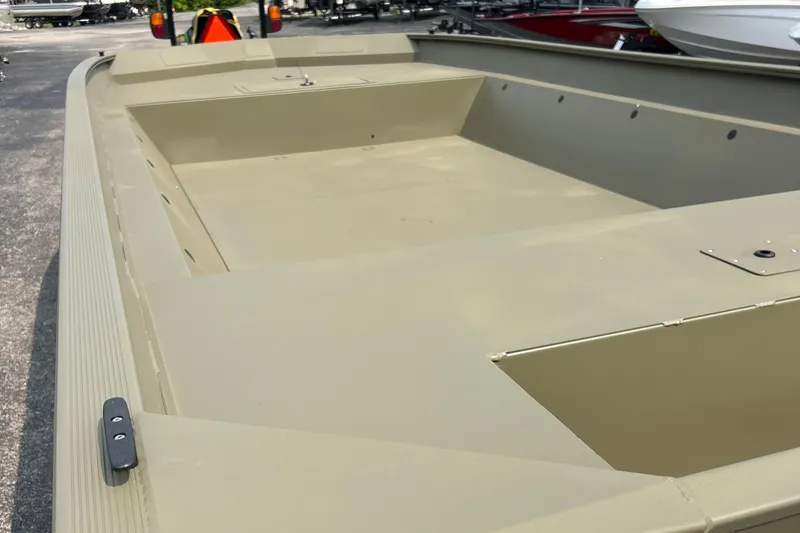 Slide: The Image of 2025 Tracker GRIZZLY 2072 Utility boat, spacious deck, beige color, outdoor setting. - 4