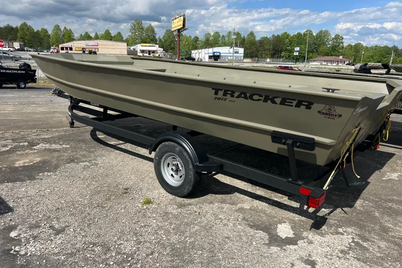 Slide: The Image of 2025 Tracker Grizzly 2072 Utility boat on trailer in outdoor setting. - 9