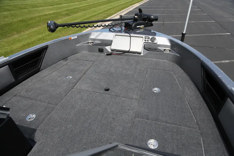 Slide: The Image of 2025 Ranger 2080MS boat deck with trolling motor and control panel. - 2