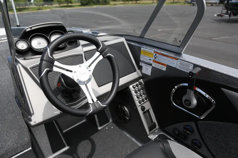 Slide: The Image of Interior view of 2025 Ranger 2080MS boat cockpit with steering wheel and control panel. - 4