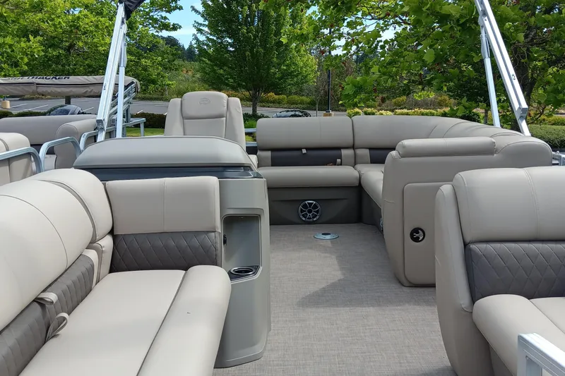 Slide: The Image of 2025 Sun Tracker Party Barge 20 DLX interior with plush seating and modern design. - 3