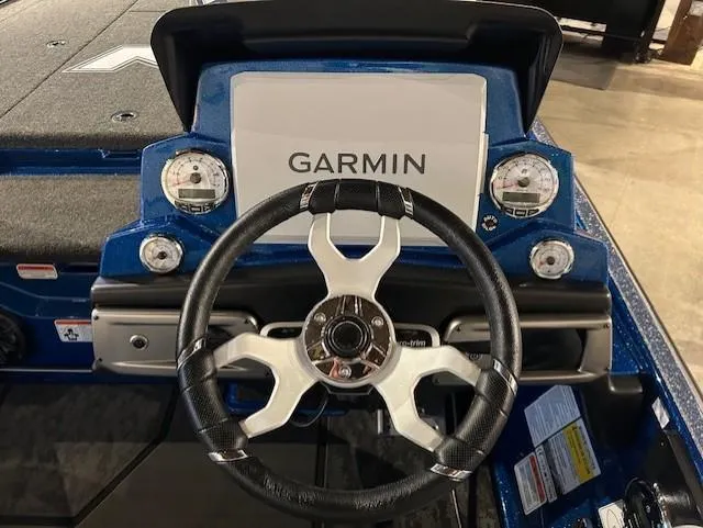 Slide: The Image of 2025 Nitro Z20 XL Pro boat dashboard with Garmin display and steering wheel. - 13