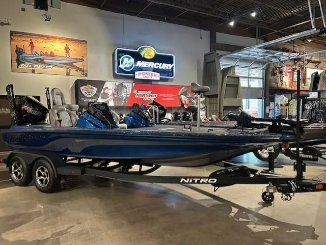 Slide: The Image of 2025 Nitro Z20 XL Pro boat displayed in showroom with Mercury signage. - 16