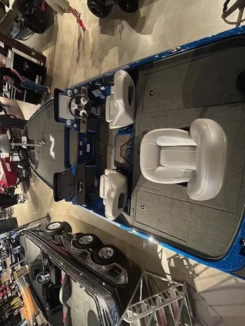 Slide: The Image of 2025 Nitro Z20 XL Pro boat interior with seating and control panel in showroom. - 9