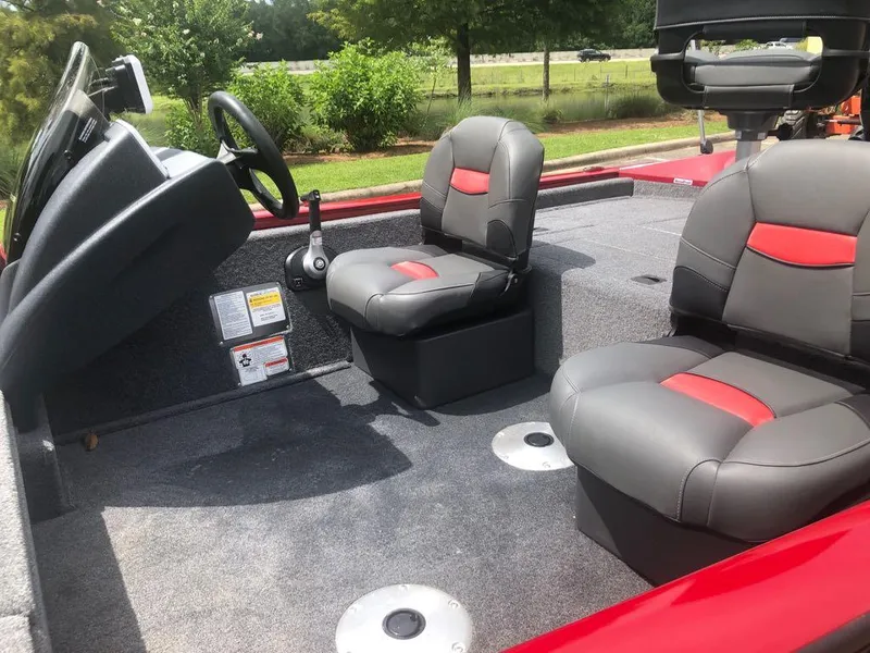 Slide: The Image of 2025 Tracker Pro Team 175 Crappie Edition boat interior with gray and red seating. - 5