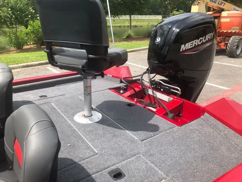Slide: The Image of 2025 Tracker Pro Team 175 Crappie Edition boat with Mercury engine, gray seating, and red accents. - 7